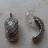 Boucles d'oreilles allong�es en m�tal argent�.