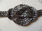 Bracelet m�tal 4 rangs, noeud plat